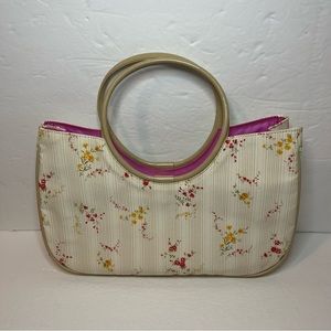 Women’s floral satchel with specialized handles